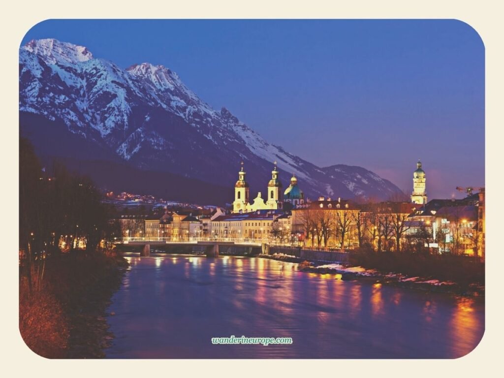 Innsbruck Cathedral and the 5 Beautiful Things Inside It 2 The Old City of Innsbruck dominated by Dom zu St. Jakob and the snow-capped Nordkette seen from the Inn River, Innsbruck, Austria
