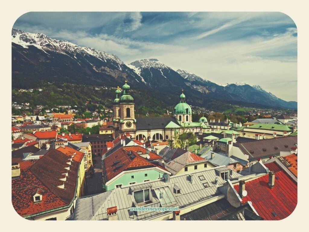 Innsbruck Cathedral and the 5 Beautiful Things Inside It 3 View of Innsbruck Cathedral against the majestic Nordkette Mountains in the backdrop, Innsbruck, Austria