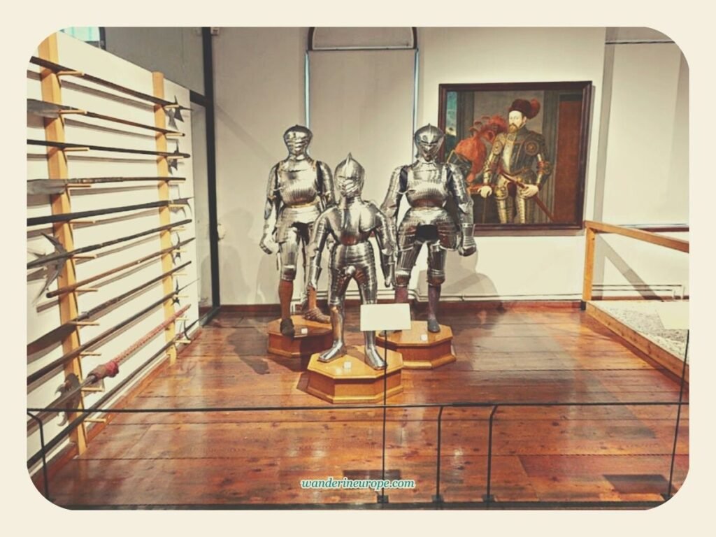 What to Expect Visiting Ambras Castle in Innsbruck (a Guide) 5 Weapons, medieval armor, and paintings in the armory of Ambras Castle, Innsbruck, Austria