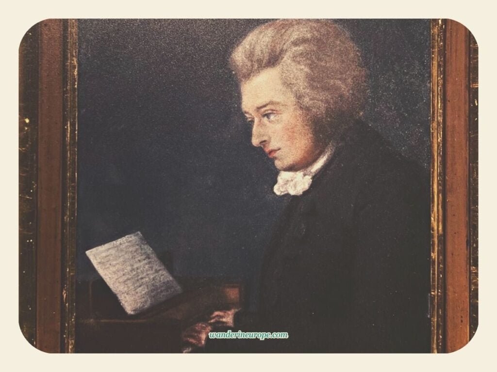 Interesting Exhibits in Mozart's Birthplace in Salzburg 9 Painting of Wolfgang Amadeus Mozart on a piano in Mozart's birthplace in Salzburg, Austria