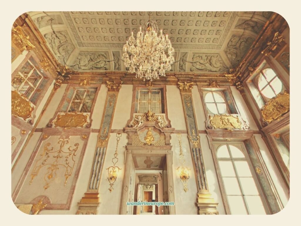 5 Beautiful Reasons to Visit Mirabell Palace & Gardens 12 The grandeur of the Marble Hall with its shining chandelier and gorgeous entrance in Mirabell Palace in Salzburg, Austria