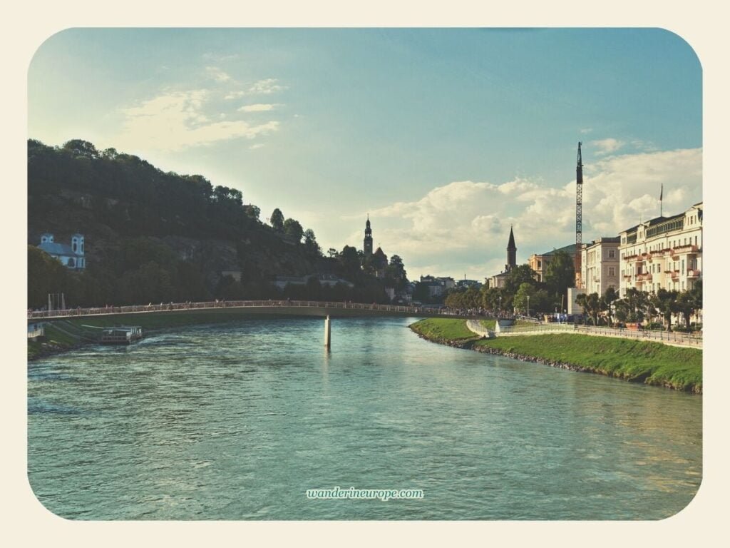 A Guide to Mönchsberg, Salzburg (Going There & Things to Do) 3 View of Mönchsberg (left) while crossing the River Salzach in Salzburg, Austria