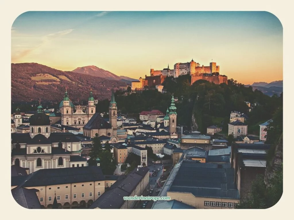Golden Hour view of Old Town Salzburg and Hohensalzburg Fortress (zoomed in) from Museum der Moderne in Monchsberg, Salzburg, Austria