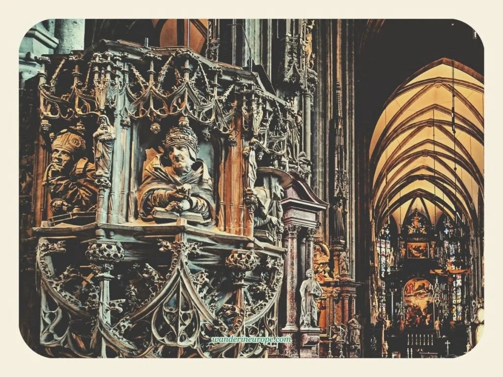 The beautiful pulpit with the view of the altar in St. Stephen’s Cathedral, Vienna, Austria