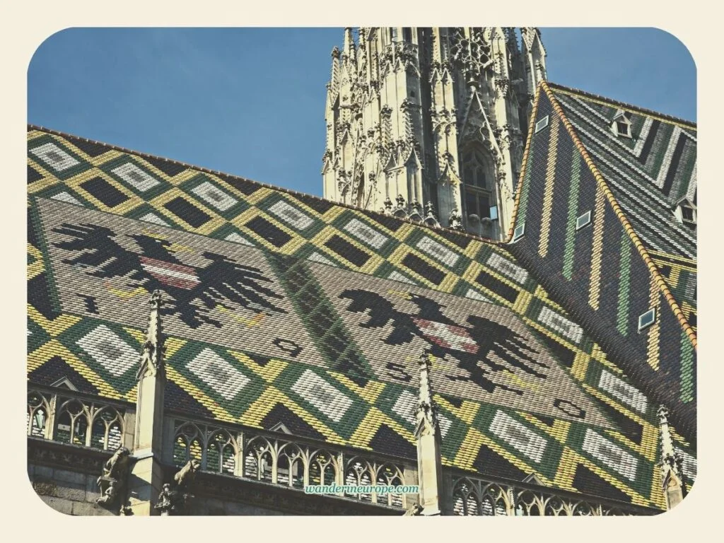 The coat of arms of Vienna and Austria on the roof of Saint Stephen’s Cathedral, Vienna, Austria