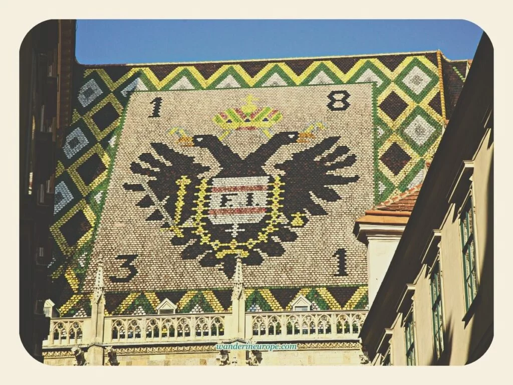 The emblem of the Habsburgs on the roof of Saint Stephen’s Cathedral, Vienna, Austria