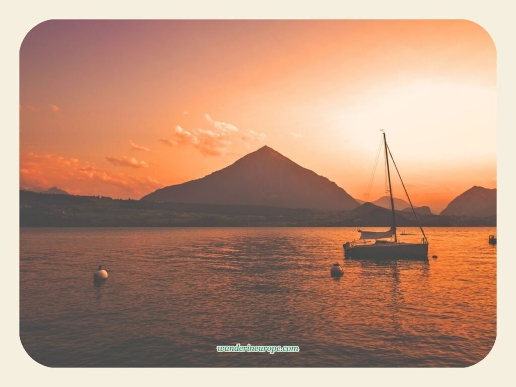 How to Spend One Day in Thun (an Easy Day Trip Itinerary) 37 Golden hour view of Mount Niesen from Oberhofen Castle in Thun, Switzerland