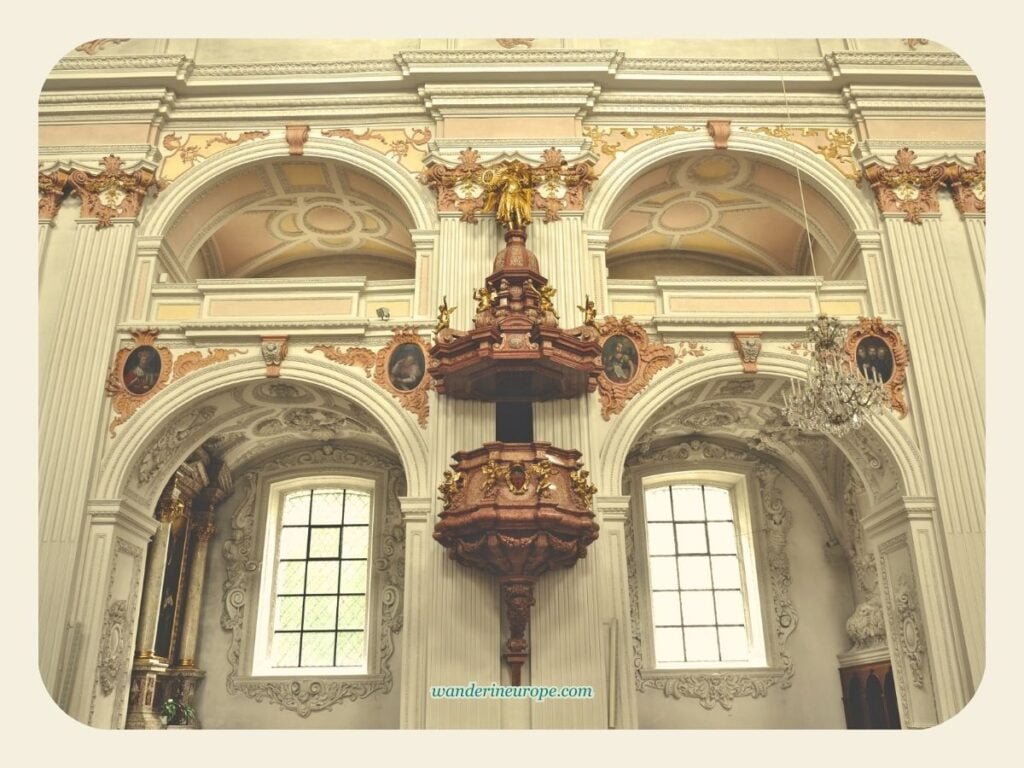 See Lucerne's Jesuit Church Interiors (+ Photography Tips) 10 The pulpit and the beautiful arches of the chapels of the Jesuit Church in Lucerne, Switzerland