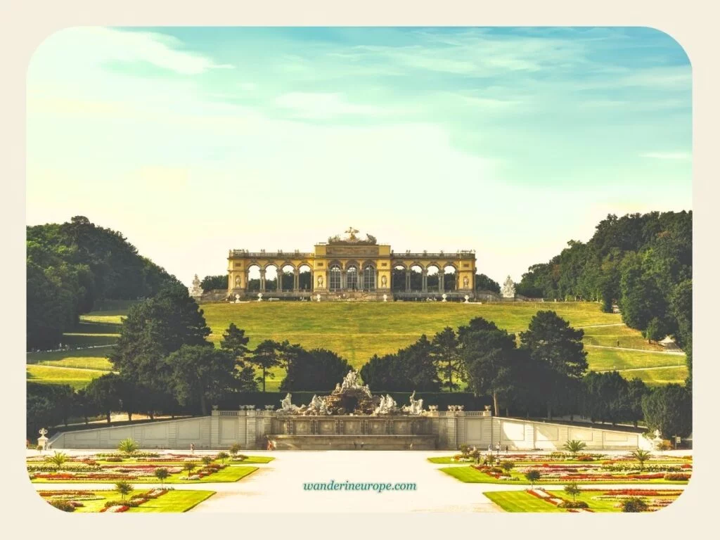 View of the Neptune Fountain and Gloriette from the Great Parterre of Schönbrunn Palace, second photo spot of Schönbrunn Palace, Vienna, Austria