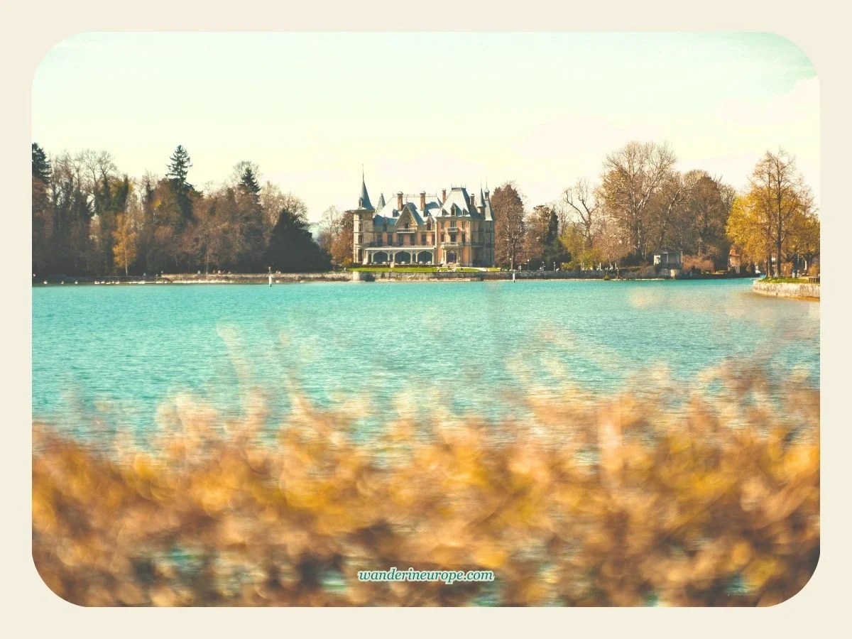 Zoomed in shot of Schadau Castle from Hünibach ferry terminal in Thun, Switzerland