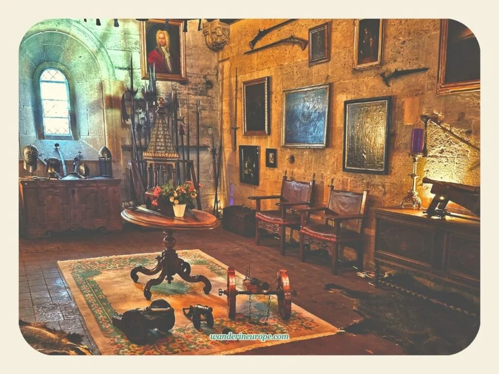 Medieval tools, armors, and gun-powered weapons inside Knappensaal of Liechtenstein Castle, Vienna, Austria