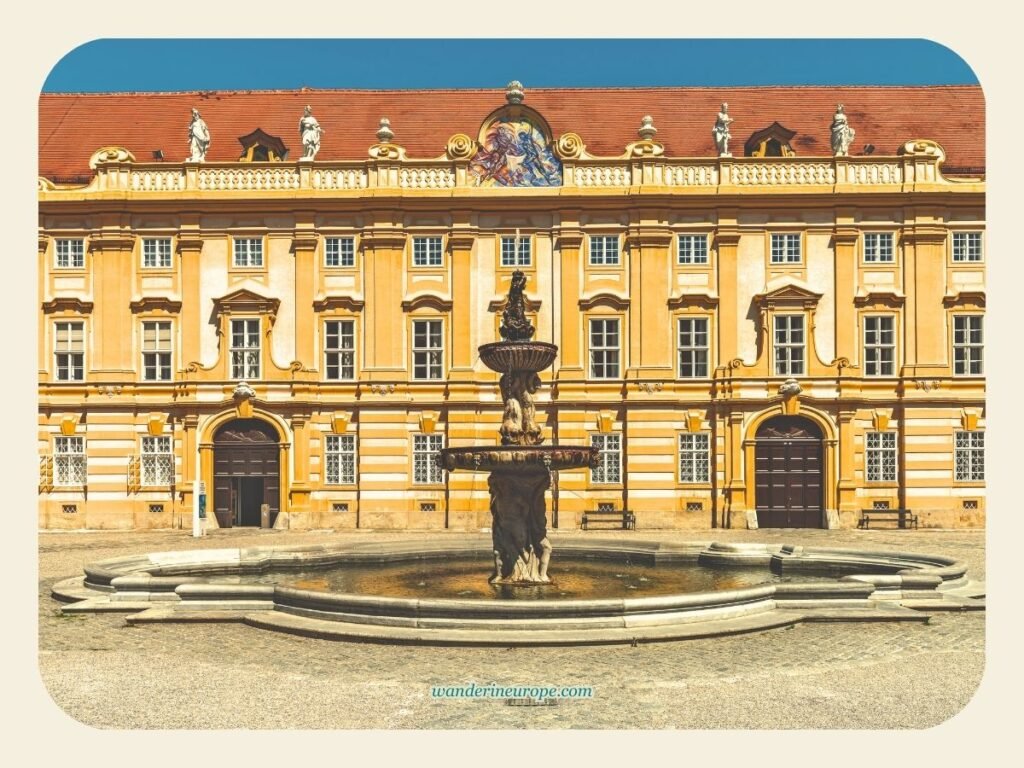 A Guide to Melk Abbey (a Beautiful Day Trip from Vienna) 11 The fountain in the courtyard of Melk Abbey, a lovely place for a day trip from Vienna, Austria