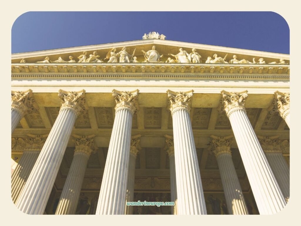 10 Architectural Marvels in Vienna + Tips for Your Visit 14 The imposing facade of the Austrian Parliament Building, an architectural attraction in Vienna, Austria