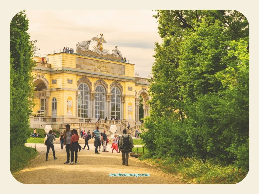 Vienna One-Day Budget Itinerary: Sightseeing Top Attractions 34 The facade of Gloriette — view from the pathway from the Great Parterre of Schonbrunn Palace in Vienna, Austria