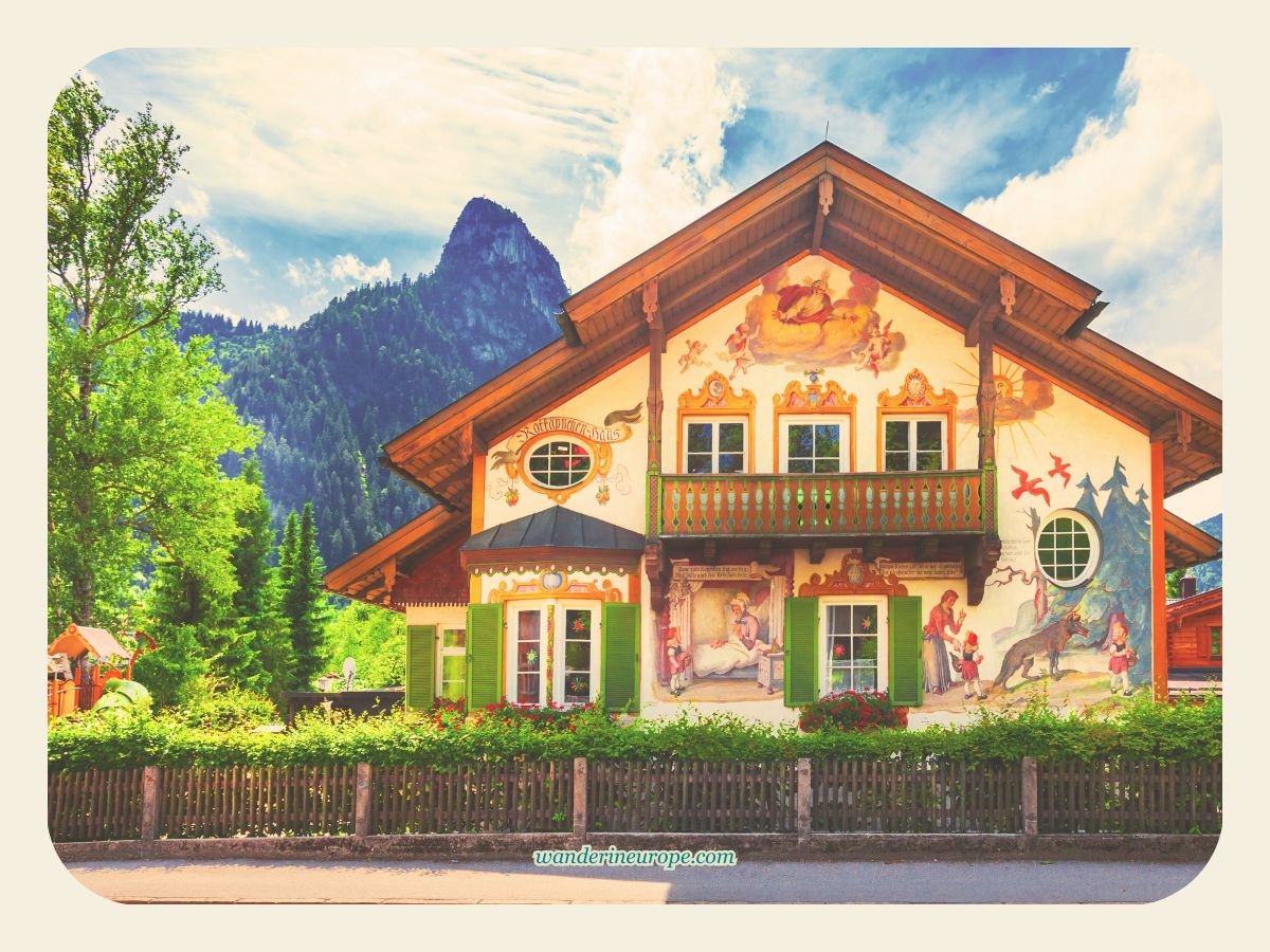 10 Stunning Bucket List Destinations in Southern Germany 23 Mount Kofel behind a Lüftlmalerei house in Oberammergau, Germany