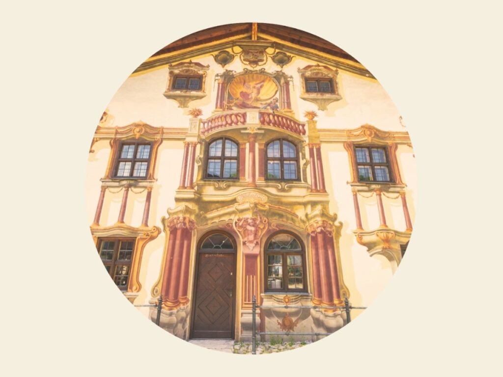 Lüftlmalerei in Oberammergau: The Fusion of Art and Culture 3 The facade of a three story building covered with Lüftlmalerei in Oberammergau, Germany