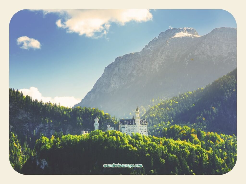 View of Neuschwanstein Castle with the mountains of the Bavarian Alps from Schwangau, Germany