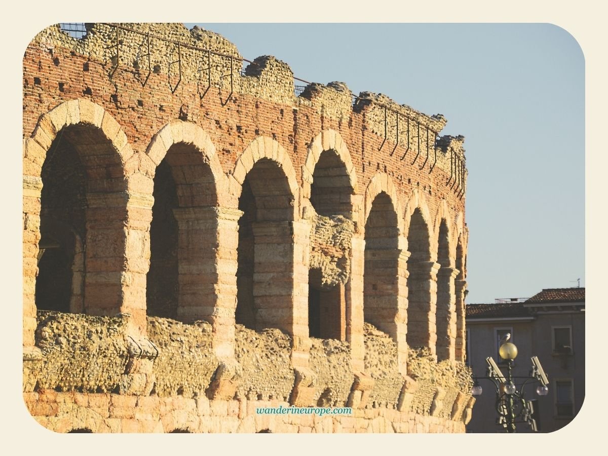 A Guide to Discovering Verona: Its Beauty, History & Romance 15 A more ancient looking facade of the arena, Verona, Italy
