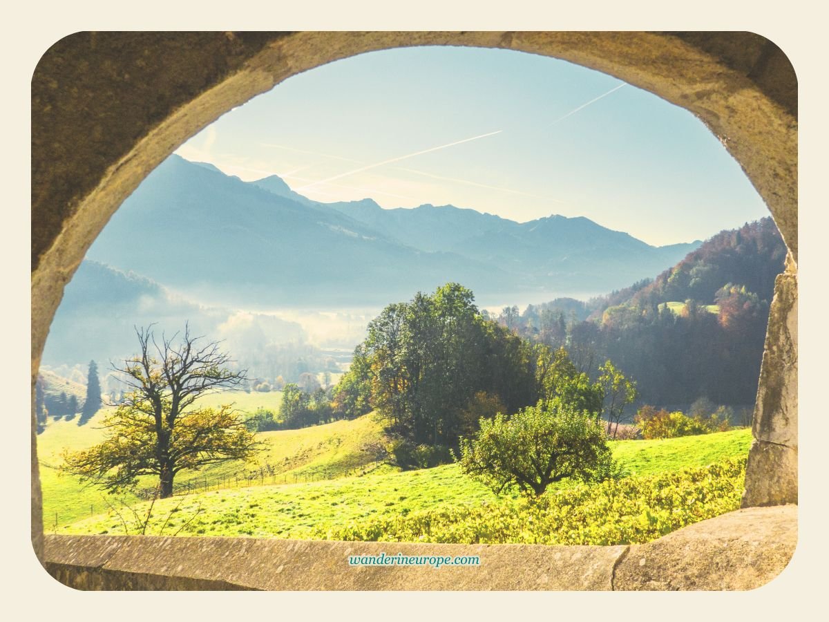 Countryside scenery from the masonry arch window in Gruyeres, Switzerland